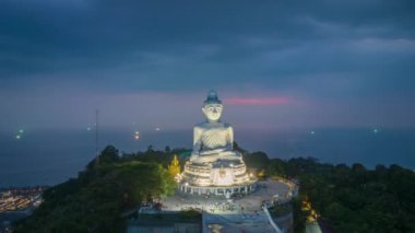 aerial Hyperlapse view around Phuket big Buddha in blue sky background.Phuket white big Buddha is the famous landmark in Phuket. Aerial panoramic view landscape Phuket big Buddha.
