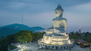 aerial Hyperlapse view around Phuket big Buddha in blue sky background.Phuket white big Buddha is the famous landmark in Phuket. Aerial panoramic view landscape Phuket big Buddha.