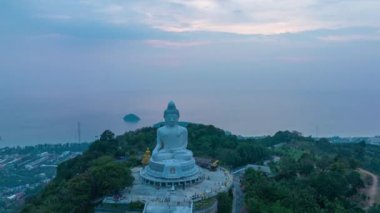 aerial Hyperlapse view around Phuket big Buddha in blue sky background.Phuket white big Buddha is the famous landmark in Phuket. Aerial panoramic view landscape Phuket big Buddha.