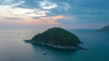 aerial hyperlapse view sunset at Laem Promthep Cape..Promthep cape viewpoint is the most popular viewpoint in Phuket island..time lapse day to night 4K video of Majestic sunset landscape..