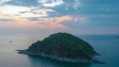 aerial hyperlapse view sunset at Laem Promthep Cape..Promthep cape viewpoint is the most popular viewpoint in Phuket island..time lapse day to night 4K video of Majestic sunset landscape..