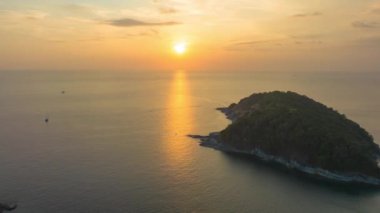 aerial hyperlapse view sunset at Laem Promthep Cape..Promthep cape viewpoint is the most popular viewpoint in Phuket island..time lapse day to night 4K video of Majestic sunset landscape..