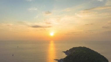aerial hyperlapse view sunset at Laem Promthep Cape..Promthep cape viewpoint is the most popular viewpoint in Phuket island..time lapse day to night 4K video of Majestic sunset landscape..