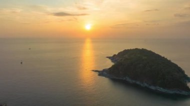 aerial hyperlapse view sunset at Laem Promthep Cape..Promthep cape viewpoint is the most popular viewpoint in Phuket island..time lapse day to night 4K video of Majestic sunset landscape..