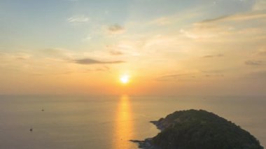 aerial hyperlapse view sunset at Laem Promthep Cape..Promthep cape viewpoint is the most popular viewpoint in Phuket island..time lapse day to night 4K video of Majestic sunset landscape..