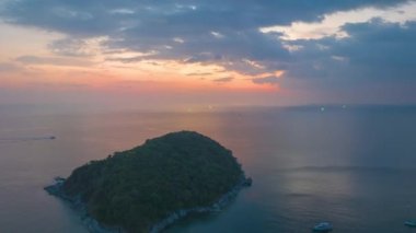 aerial hyperlapse view sunset at Laem Promthep Cape.Promthep cape viewpoint is the most popular viewpoint in Phuket island.time lapse day to night 4K video of Majestic sunset landscape.