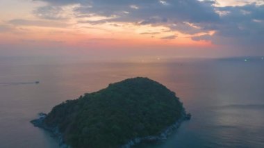 aerial hyperlapse view sunset at Laem Promthep Cape.Promthep cape viewpoint is the most popular viewpoint in Phuket island.time lapse day to night 4K video of Majestic sunset landscape.