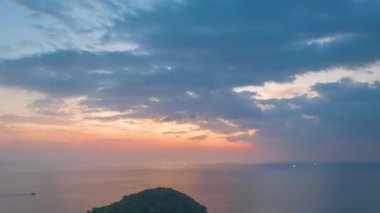 aerial hyperlapse view sunset at Laem Promthep Cape.Promthep cape viewpoint is the most popular viewpoint in Phuket island.time lapse day to night 4K video of Majestic sunset landscape.