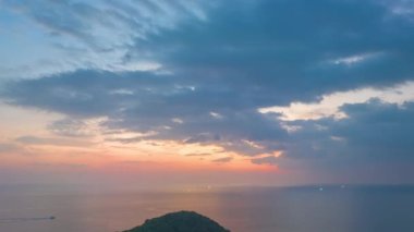 aerial hyperlapse view sunset at Laem Promthep Cape.Promthep cape viewpoint is the most popular viewpoint in Phuket island.time lapse day to night 4K video of Majestic sunset landscape.