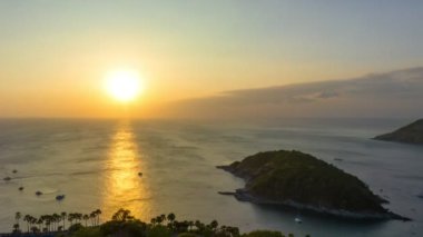 aerial hyperlapse view sunset at Laem Promthep Cape.Promthep cape viewpoint is the most popular viewpoint in Phuket island.time lapse day to night 4K video of Majestic sunset landscape.