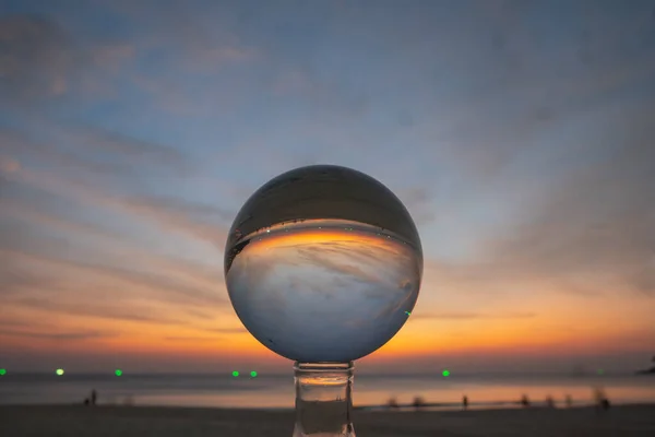 stock image view of colorful nature at sunset inside crystal ball