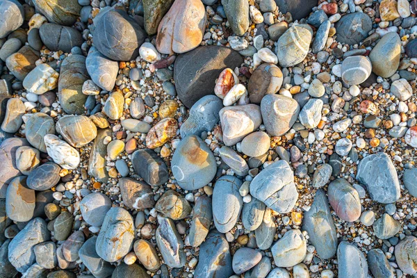 stock image amazing to see on the beach is full of round rocks instead of sand. round rocks have beautiful color and various size. rocks beach at the lighthouse landmark of Lanta island Krabi. stone background.