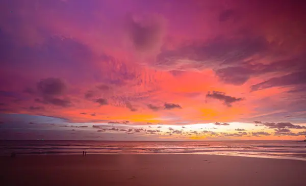 scene romantic pink sky on sunset above the ocean..Sunset with bright red light rays and other atmospheric effects..colorful cloud in bright sky. Sky texture abstract nature background..