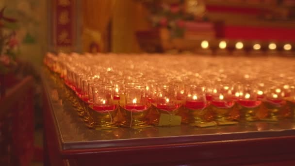Bokeh Candlelights Shrine Altar Table Candles Orange Yellow Glasses Placed — Stock Video