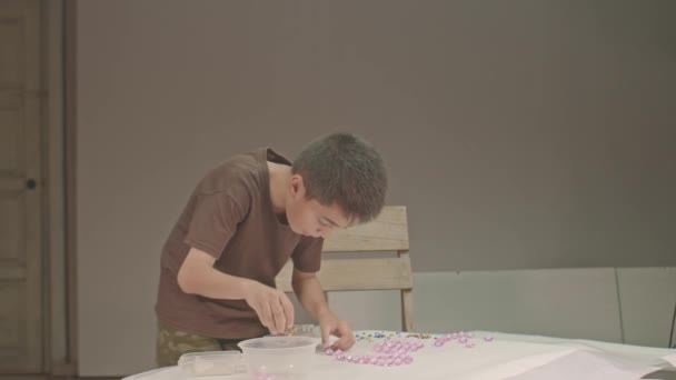Boy Carefully Uses Diamonds Make Letters Studio High Quality Video — Stock Video