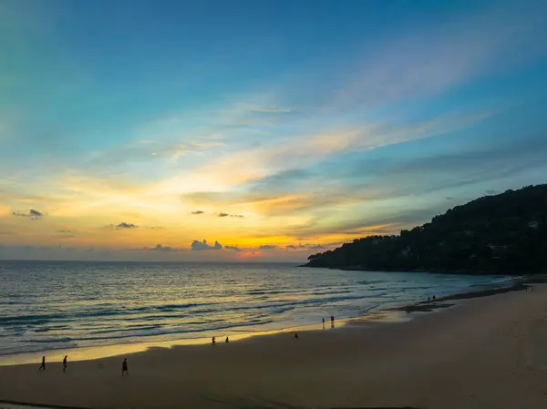 reflection of scenery romantic sky of sunset at Karon beach