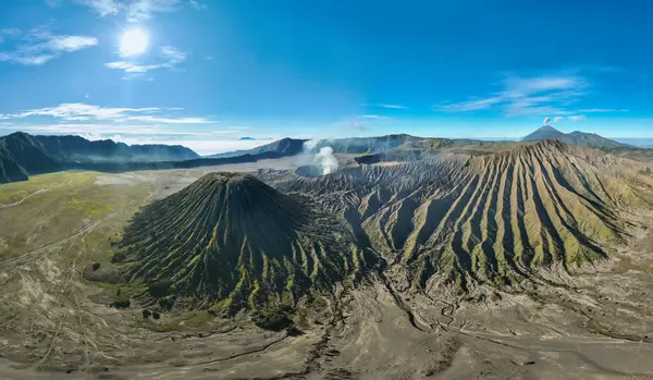 stock image Aerial panorama view Bromo volcano constantly spews white smoke from its crater