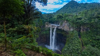 Coban Sriti Waterfall twin Waterfall stream that flows down the valley.The water flowed down into the winding mountain ridges as far as the eye could see. green forest   clipart