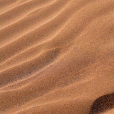 Kum dokusu kum tepecikleri çöl dalgaları arka plan dalgaları plaj gelgitlerini kapatır. Yüksek kalite fotoğraf