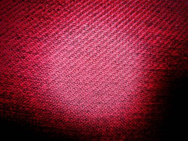 Pullu kırmızı kumaşın arkaplan dokusu