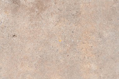 Sert deseni ve kahverengimsi gri renkleri olan beton kaldırım bölümünün ayrıntıları.