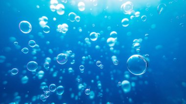 Bubbles up close in blue water. Underwater background with air bubbles. clipart