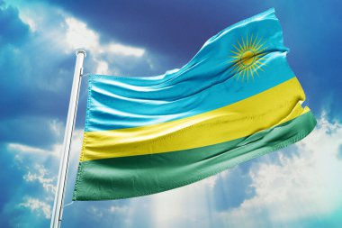 Mavi gökyüzü arka planında dalgalanan ruanda bayrağı