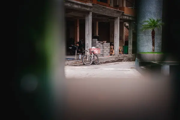 On the bicycles seen from behind the gate of a house in Tabanan, Bali