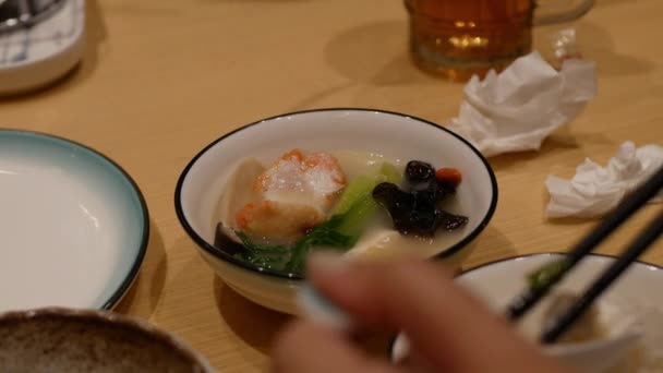 Eating Chinese Hotpot Suki Steam Stew Chopstiks Salmon Meat Ball — Stock Video
