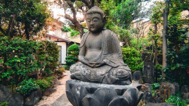 Stone Buddha in Shinkoin Temple Precincts.Jodo sect ShinkoinA Jodo sect temple in Minato Ward, Tokyo. It prospered as a separate temple of Zojoji Temple.It was opened in 1393 (Meitoku 4th year) by Seiso. clipart