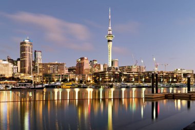 Auckland. New Zealand. The city skyline. View from Viaduct Harbour at sunset - Date: 18 - 08 - 2023 clipart