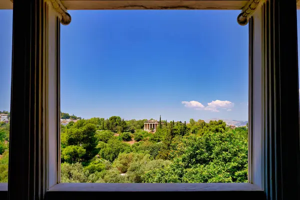 Athens Greece.  Framed view of the Temple of Hephaestus at the Ancient Agora - Date: 07 - 06 - 2023