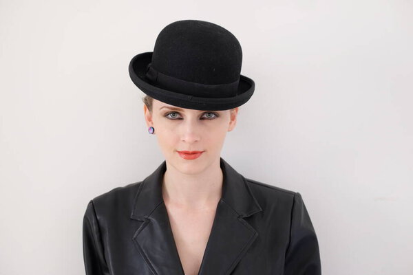 woman in retro style with a black hat on her head
