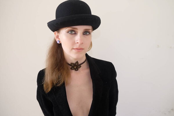 a woman with a hat and a black shirt