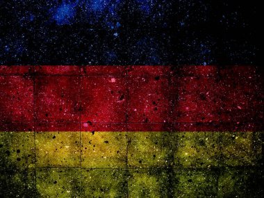 Alman bayrağıyla boyanmış granit bir duvarın fotoğrafı.