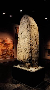 photo of The replica of the Tikal Stela 31 in the gallery of The Mayan Culture at National Museum of Anthropology (MNA) in Mexico City clipart