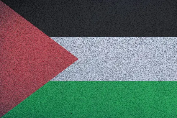 Filistin Bayrağı 'nın arkaplanı desenli bir duvarın üzerinde.