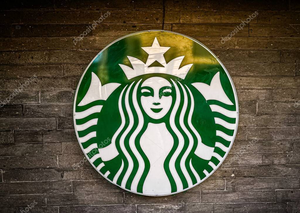 The Green and white  symbol for Starbucks, chain of coffeehouses and roastery reserves, exterior wall.
