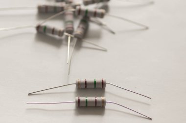 Close-up of color-coded resistors on a white background clipart