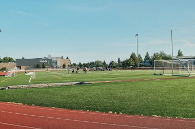 Milton WA USA, July 20, 2025 - Surprise Lake Middle School, football pitch with running tracks on the grounds of the middle school