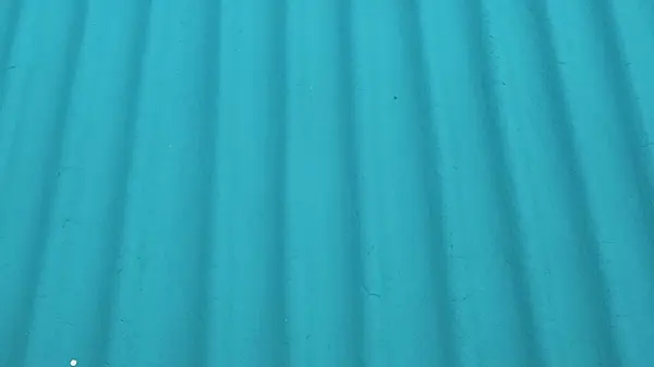 Teal kıvrımlı metal yüzey dokusu