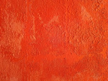 Kaba, desenli turuncu bir duvara yakın çekim