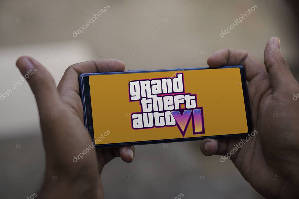 Dhaka, Bangladesh - 06 December 2023:GTA VI logo and Rockstar games company logo in background on screen. GTA SIX video game. High quality photo