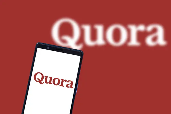 Stock image Dhaka, Bangladesh - 11 December 2023: Quora logo is seen on a mobile phone and a computer screen.