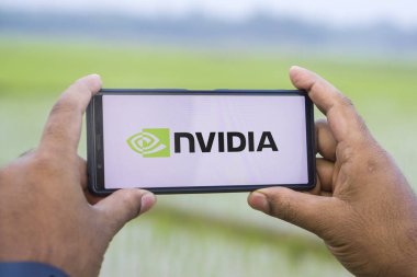 Dhaka, Bangladesh 12 Jan 2025: The NVIDIA logo is being displayed on a smartphone. clipart