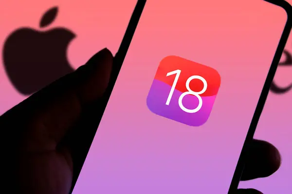 Dhaka, Bangladesh- 05 Apr 2024: Apple IOS 18 icon on smartphone and Apple logo on the background.