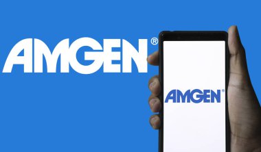 Dhaka,Bangladesh 21 May 2024:Cellphone with logo of American biopharmaceutical company Amgen Inc. clipart