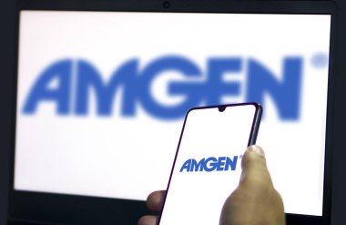 Dhaka,Bangladesh 21 May 2024:Cellphone with logo of American biopharmaceutical company Amgen Inc. clipart