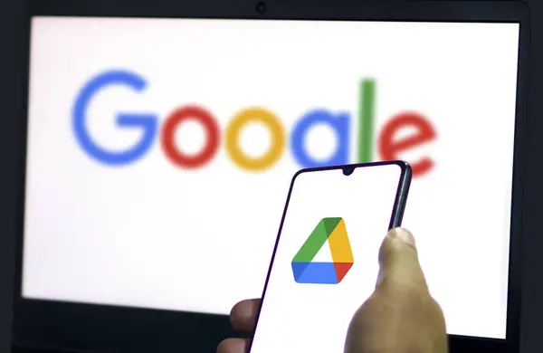 stock image Dhaka,Bangladesh 06 June 2024:Man holding a smartphone with Google Drive cloud storage app on smartphone.