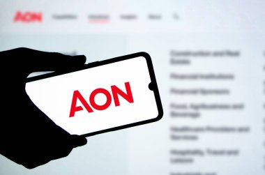 Dhaka,Bangladesh 24 June 2024:Smartphone displaying logo of Aon PLC, a British multinational professional services firm that sells a range of financial products. clipart